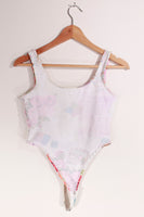 1980s Active Image Thong Bodysuit with Aesthetic Print Made in the USA tagged size Large but runs very small