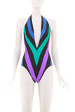 One-piece swimsuit with a plunging neckline and high cut thighs. The color is blue, black, turquoise and purple and is a flattering chevron print.